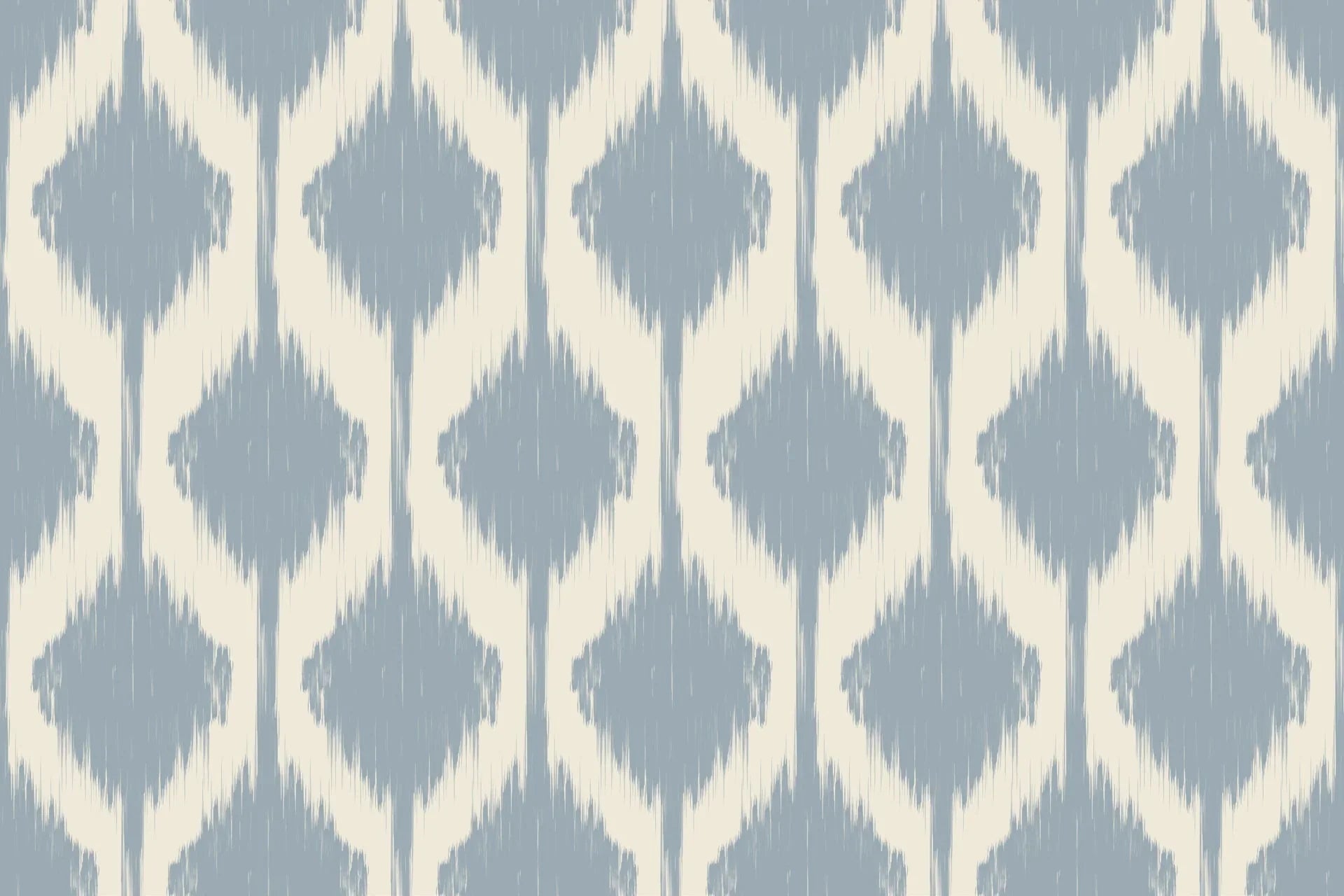 Blurred diamond motifs in soft blue, repeating across an ikat-style wall covering on a warm ivory base