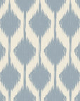 Blurred diamond motifs in soft blue, repeating across an ikat-style wall covering on a warm ivory base