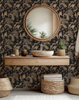 A moody, traditional paisley peel-and-stick wallpaper in deep dark brown and black shades (Earthen Whispers)