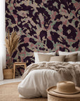 A removable adhesive wallpaper featuring an abstract design of pink and green leopard spots, titled Earthy Echoes