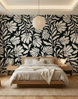 Ebony Garden black and cream floral silhouette wallpaper adding character to a cozy bedroom