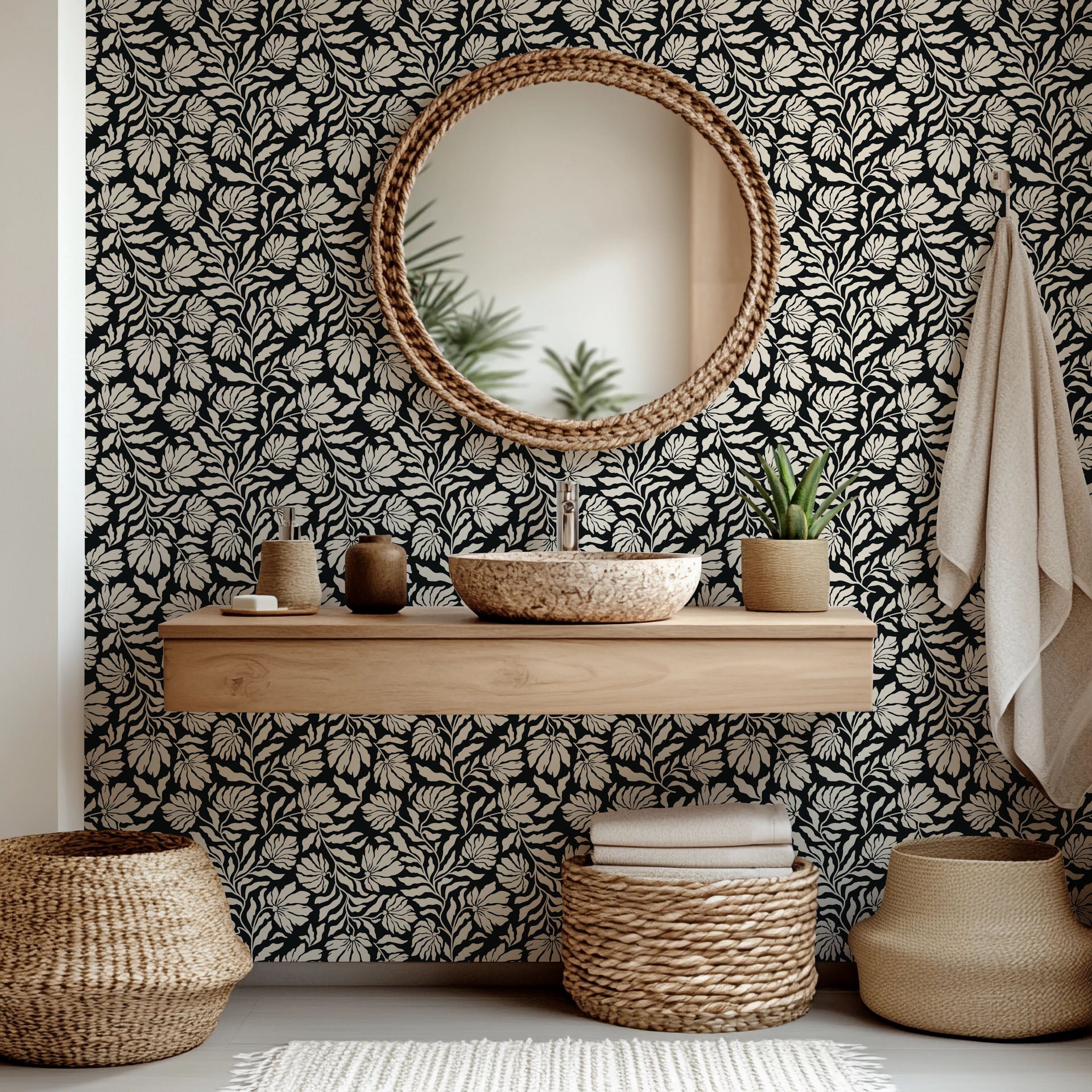 A removable, self-adhesive wallpaper featuring a black and ivory floral silhouette design, called Ebony Garden