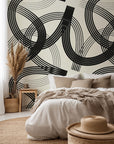 Echo Bound wallcovering features a geometric, abstract design of curving black and cream lines
