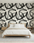 Echo Bound Black white abstract curved line wallpaper adding character to a cozy bedroom