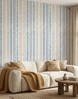 Ecliptic Flow blue grey distressed stripe wallpaper in a warm and inviting living room