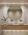 Ecliptic Flow blue grey distressed stripe wallpaper creating ambiance in a serene bathroom