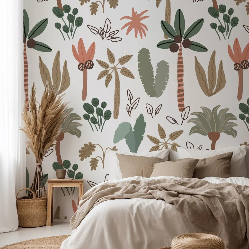 Soft pastel green and pink palm leaves on a bohemian nursery peel and stick wallpaper