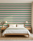 Ember Blush pink and green horizontal stripe wallpaper adding character to a cozy bedroom