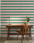 Ember Blush pink and green horizontal stripe wallpaper as a feature wall in a bright home office