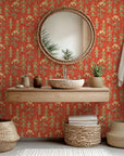 Peel and stick wall covering featuring an herbal botanical design in green and terracotta red - Ember Meadow