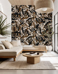 Self-adhesive wallpaper featuring an abstract, organic pattern of black and brown veins, named Ember Veins