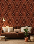 Ember Wings rust brown tribal ikat geometric wallpaper in a warm and inviting living room