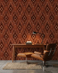Ember Wings rust brown tribal ikat geometric wallpaper as a feature wall in a bright home office
