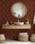 Peel and stick wallpaper, known as 'Ember Wings,' featuring a geometric Ikat pattern in rust brown and beige tones