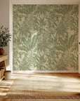 Antique-style tropical leaves on a sage green self-adhesive wallpaper background