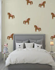 Vintage nursery wall covering featuring playful carousel horses on a soft cream background - Equestrian Dream