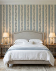Ethereal Stripes blue and beige floral stripe wallpaper adding character to a cozy bedroom