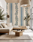 Self-adhesive wallpaper featuring a cream and blue vertical stripe and botanical vine pattern, style name Ethereal Stripes
