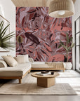 A self-adhesive, removable wall covering featuring an abstract camouflage lattice pattern in shades of pink and maroon