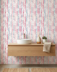 Faded Orchard Drift pink and blue floral wallpaper as a feature wall in a bright home office