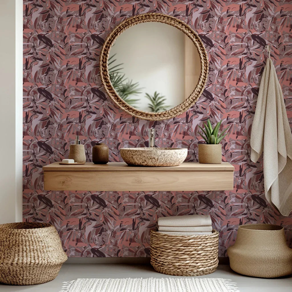A peel and stick wallpaper featuring a faded, abstract lattice pattern overlaid with pink and maroon camouflage colors.