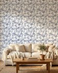 Gray and white Fallen Leaves botanical wallpaper on bedroom accent wall with natural linen bedding