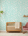 First Bloom aqua floral peel and stick wallpaper in a warm and inviting living room