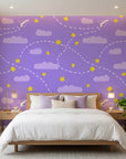 Flight Dreams purple paper airplane and star wallpaper adding character to a cozy bedroom