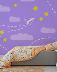 Removable wall covering featuring a playful design of purple paper aircraft and bright yellow star motifs - Flight Dreams