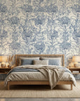 Distressed blue and beige Fog Garden wallpaper with ornate damask motifs on bedroom accent wall