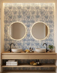Blue and cream Fog Garden peel and stick wallpaper with botanical motifs in modern bathroom setting