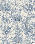 Vintage Fog Garden wallpaper with blue botanical motifs and distressed texture on cream background