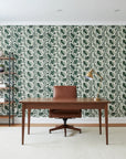 Foliage Fragments dark green tropical leaf wallpaper as a feature wall in a bright home office