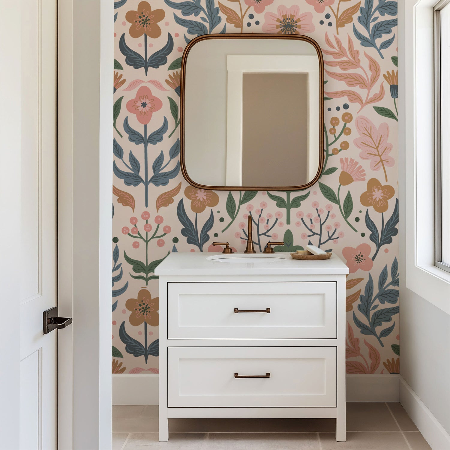 Soft folk-art floral wallpaper with stylized flowers, leaves, and berries in muted pink, sage green, dusty blue, and warm ochre on a pale blush background.