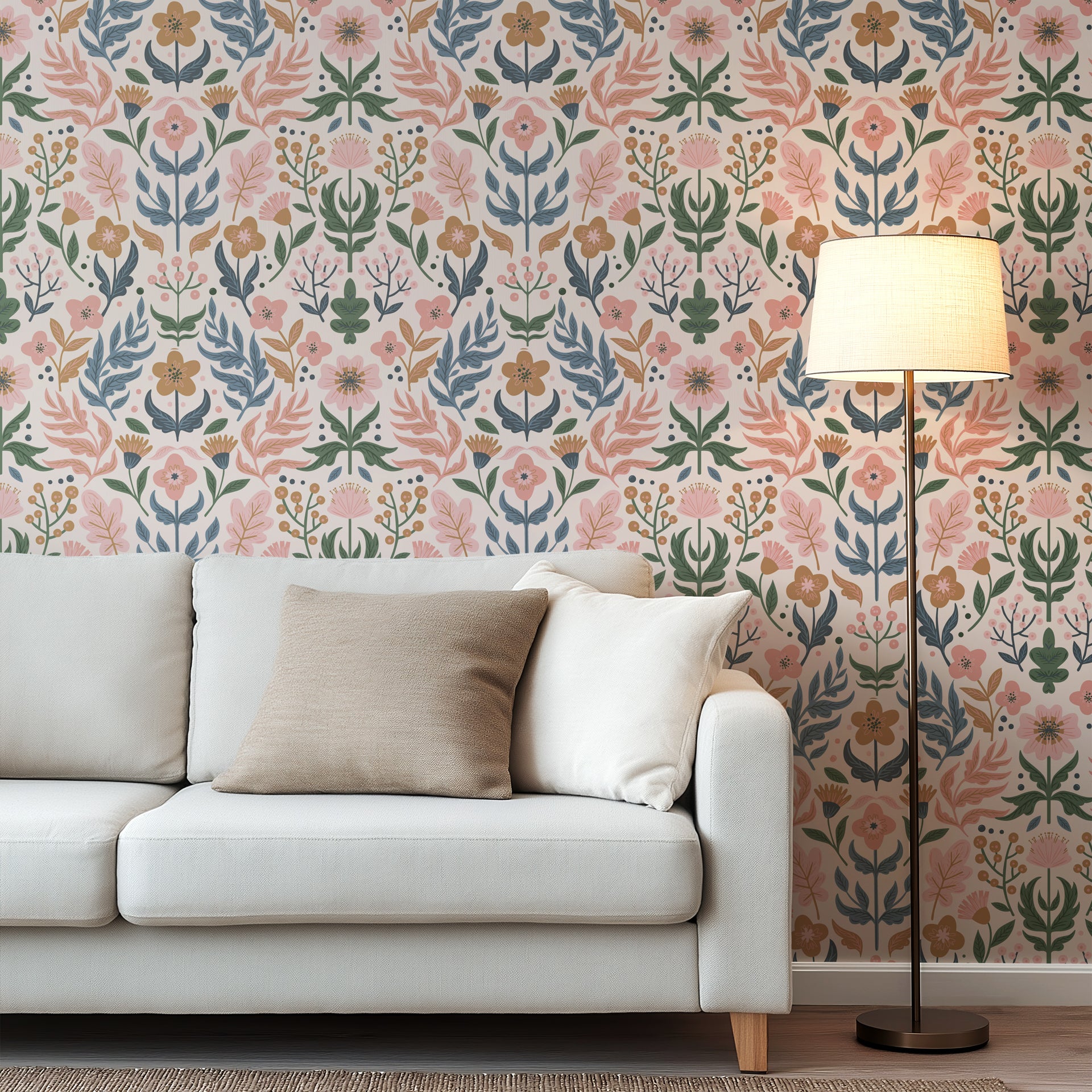 Soft folk-art floral wallpaper with stylized flowers, leaves, and berries in muted pink, sage green, dusty blue, and warm ochre on a pale blush background.