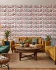 Folk Rose Stitch red and black folk rose wallpaper in a warm and inviting living room