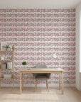 Folk Rose Stitch red and black folk rose wallpaper as a feature wall in a bright home office
