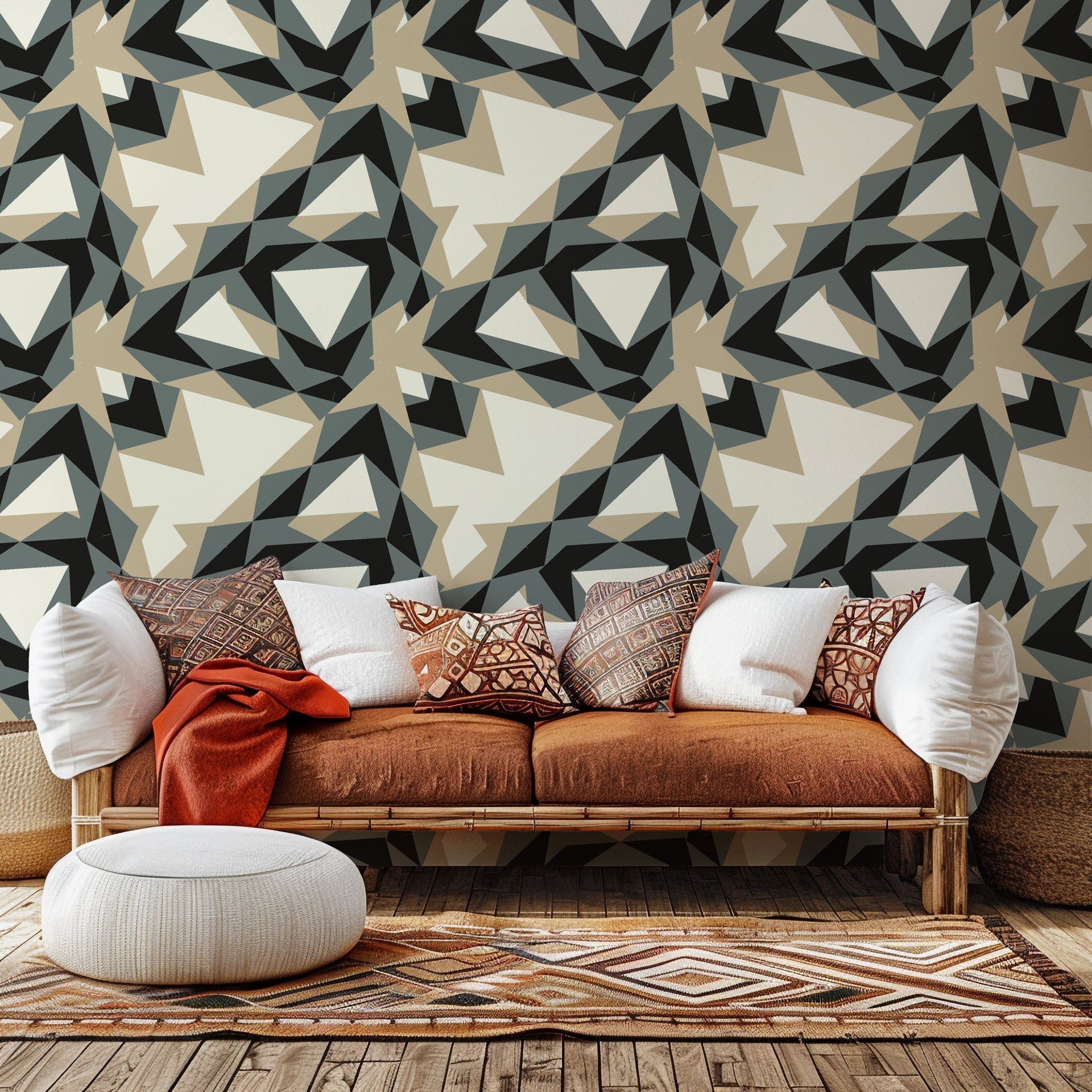 Peel and stick wallpaper featuring a modern geometric pattern of grey and beige triangles, called Fractured Light
