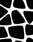 Removable black and white wallcovering featuring an abstract, non-uniform spotted pattern ('Fractured Night')