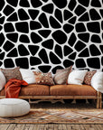 Self-adhesive black and white wallpaper featuring an abstract, irregular spot design (Fractured Night)