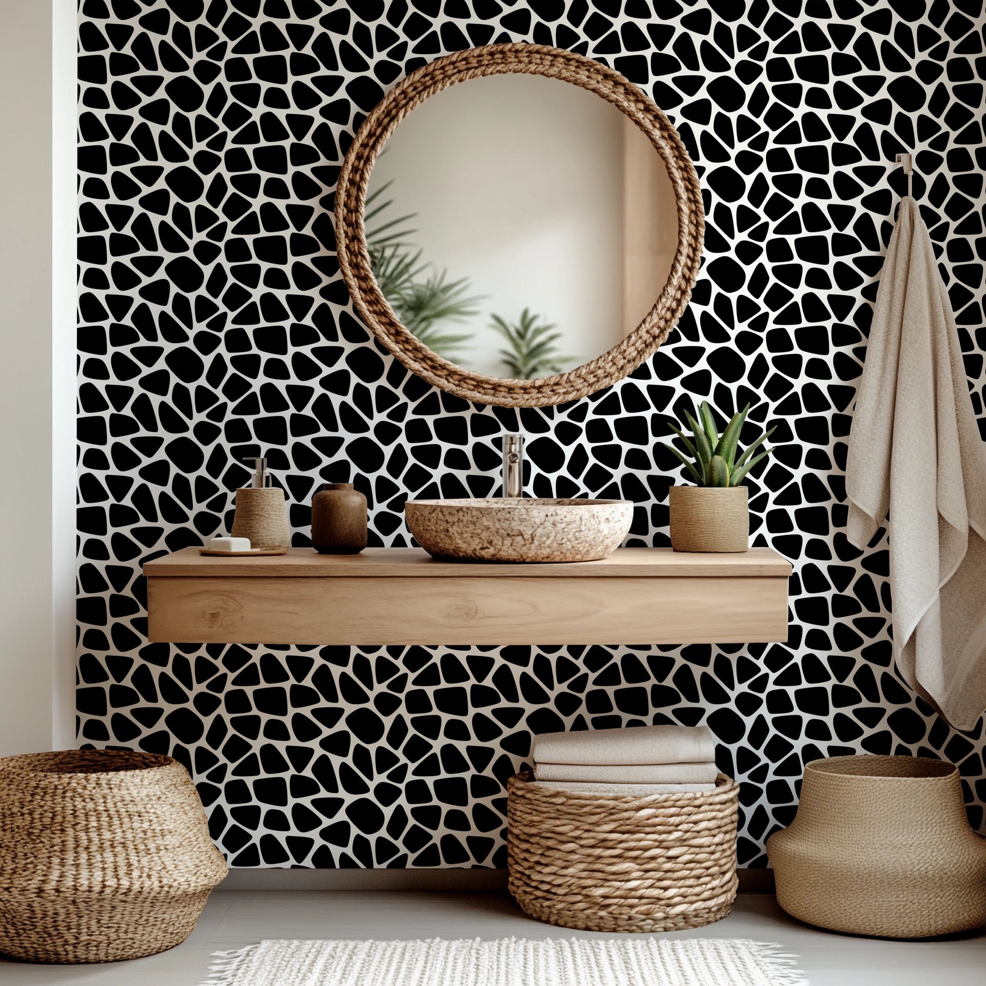 Abstract black and white, self-adhesive wall covering featuring a fragmented spot pattern, called Fractured Night