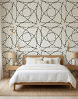 Fragmented Orbit black and cream abstract dashed line wallpaper adding character to a cozy bedroom