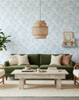 Frost Garden Veil pale blue floral silhouette wallpaper in a warm and inviting living room