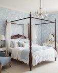 Frost Garden Veil pale blue floral silhouette wallpaper adding character to a cozy bedroom