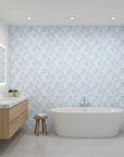 Frost Garden Veil pale blue floral silhouette wallpaper creating ambiance in a serene bathroom