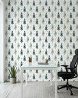 Frosted Woods sage green watercolor pine tree wallpaper as a feature wall in a bright home office