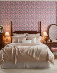 Frosted Rose Hush blush pink rose wallpaper adding character to a cozy bedroom
