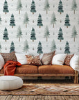 Self-adhesive wallcovering featuring a striped watercolor design of verdant pine trees, titled Frosted Woods