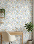 Pastel blue, pink and yellow Garden Reverie peel and stick wallpaper in modern home office setting