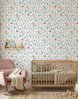 Colorful botanical Garden Trellis wallpaper with multicolor flowers in ogee pattern on nursery accent wall